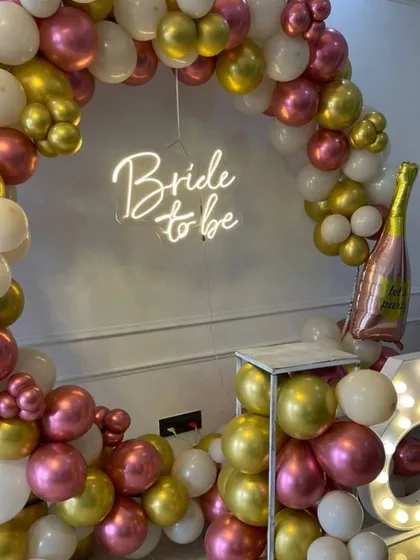 A close-up view of the 'Bride to be' balloon decor, highlighting the mix of balloon sizes and colors that create a rich, textured look.