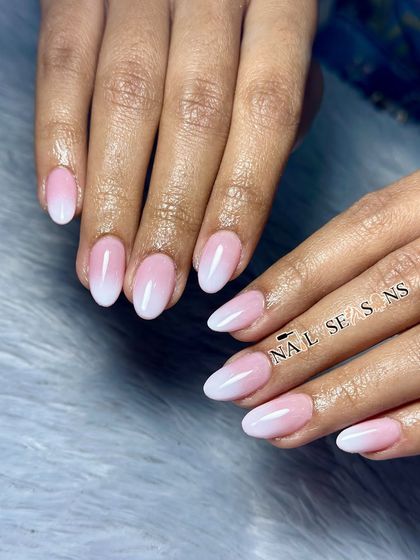 The perfect soft pink and white ombre. This is a timeless and elegant look that is perfect for any occasion.