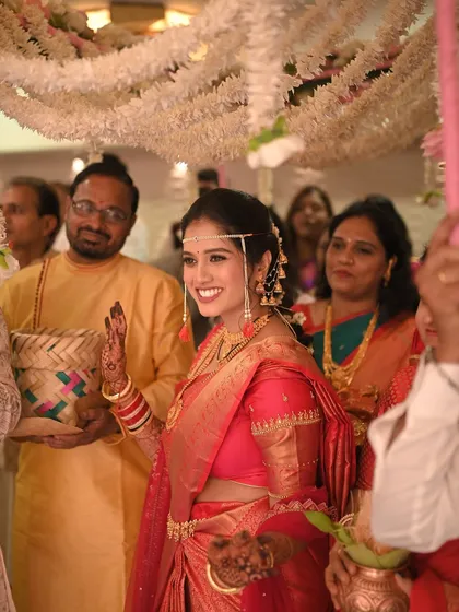 Waving to her loved ones as she makes her entrance. The makeup is flawless from every angle.