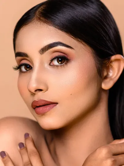 Another example of my high-end beauty retouching. This close-up shows the fine details of the makeup while maintaining a natural and beautiful skin texture.