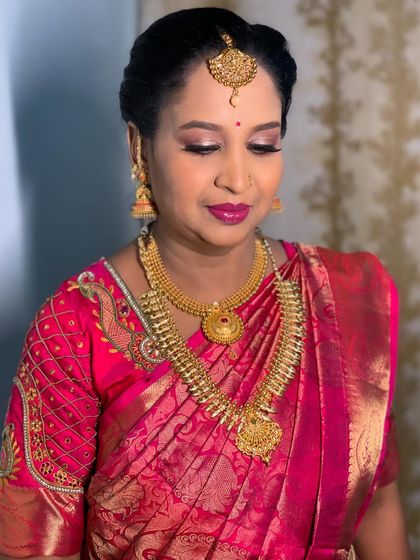 A close-up of the makeup, showing the shimmery eye look and flawless base.