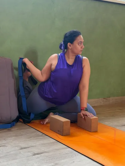 Using blocks and a strap, this member works on her flexibility safely and effectively. Our classes are tailored to individual needs.