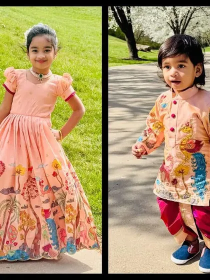 I love creating coordinated outfits for siblings. Here, a sister in a hand-painted peach gown and her brother in a matching kurta-dhoti set look absolutely perfect for a family celebration.