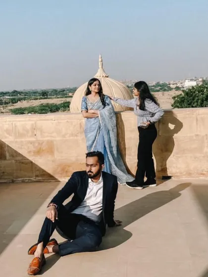Making final touch-ups on set in Jaisalmer. I'm always close by to ensure my client looks flawless throughout the shoot, adjusting for light and location changes.