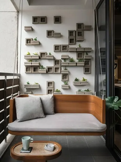 A custom-designed wooden swing bench provides the perfect spot for morning coffee or quiet reading. This piece combines comfort with a clean, modern aesthetic, complemented by a unique wall-mounted planter system for a touch of minimalist greenery.