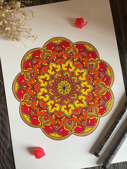 The first in a series of ornate mandalas, this piece plays with warm shades of red, orange, and yellow. It feels like a sunrise, full of hope and new beginnings.
