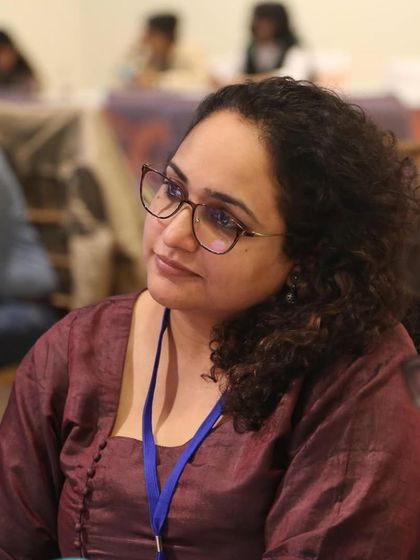 A participant listening with curiosity and engagement. Our workshops are designed to be thought-provoking and inspiring.