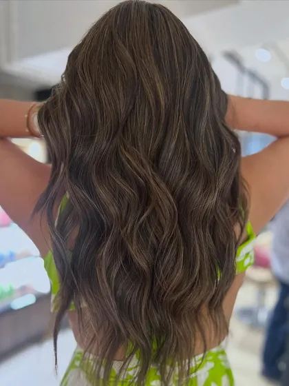 A fresh new hair color on a long layered haircut. This look is all about healthy, beautiful hair with lots of movement and shine.