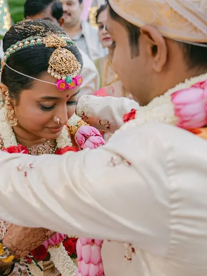 A candid moment during the garland exchange, a significant ritual in many Indian weddings. I ensure the decor enhances these moments without overwhelming them.