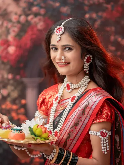Another lovely shot of a woman with a platter of Sankranti sweets. Her flowing hair adds a dynamic element to this beautiful portrait.