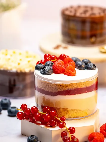 My Rakhi menu includes this beautiful Vanilla Berry Tub, layered with sponge, cream, and compote, and topped with fresh red currants, raspberries, and blueberries.