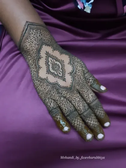 The completed design, with the central motif surrounded by incredibly fine, detailed filler work.