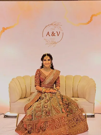 Our beautiful bride Vidhi, radiant against the custom backdrop we designed for her wedding day. The personalized monogram and soft color palette perfectly complemented her stunning bridal lehenga.
