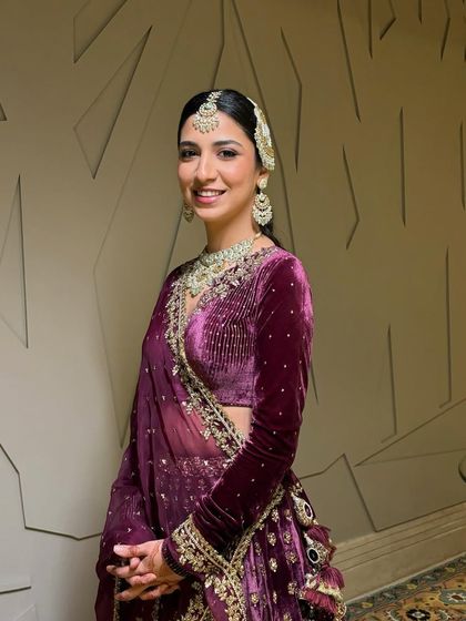 A closer look at this bride's stunning wedding day glam. The focus was on creating a luminous base that allowed her natural beauty to shine, complemented by her intricate jewelry and elegant hairstyle.