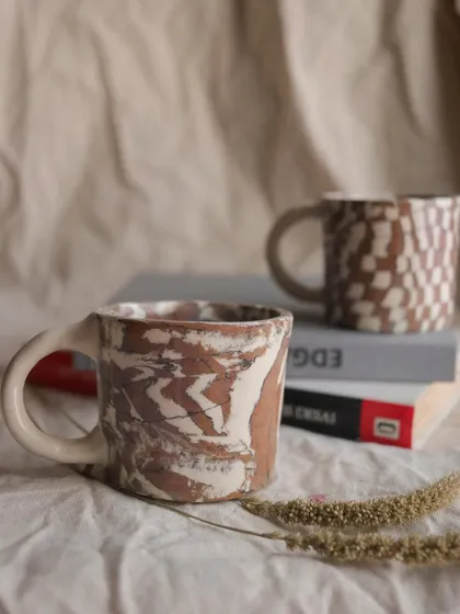 The 'Check / Uncheck' Nerikomi cup set. These little cups are perfect for an espresso shot or a cutting chai. I created the patterns by layering and slicing different colored clays.