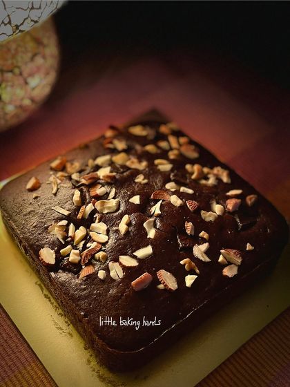 A classic chocolate nuts cake made with whole wheat flour and jaggery. The combination of rich chocolate and crunchy nuts is timeless and always a crowd-pleaser.
