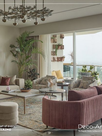 This living area is the heart of every gathering. It blends modern aesthetics with comfortable seating, featuring plush velvet sofas, contemporary furniture, and lush greenery for a welcoming atmosphere.