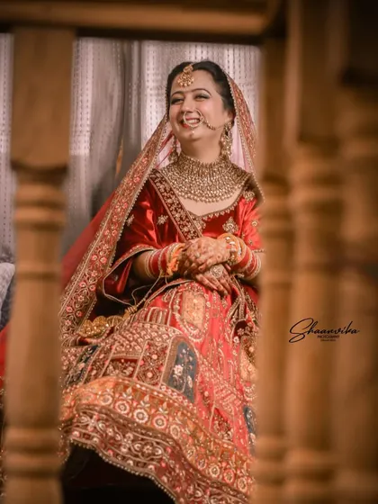 A candid shot of the bride's infectious laughter. These are the unposed, genuine moments that I love to capture and that make your wedding album truly yours.