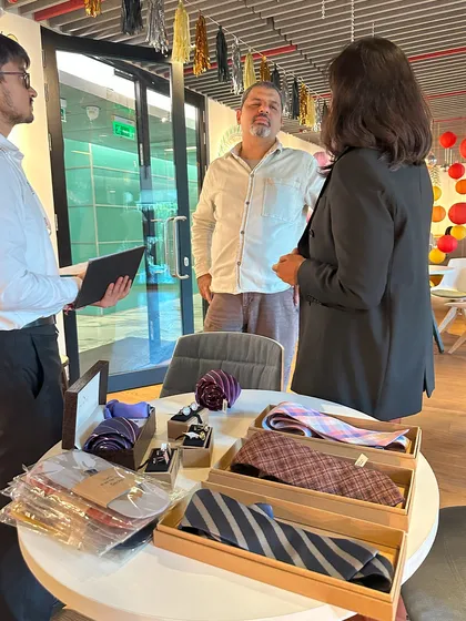Discussing accessory options at the BCG trunk show. A well-chosen tie can complete a look, and we guide clients on how to select patterns and colors that harmonize with their suits and shirts for a cohesive and professional appearance.