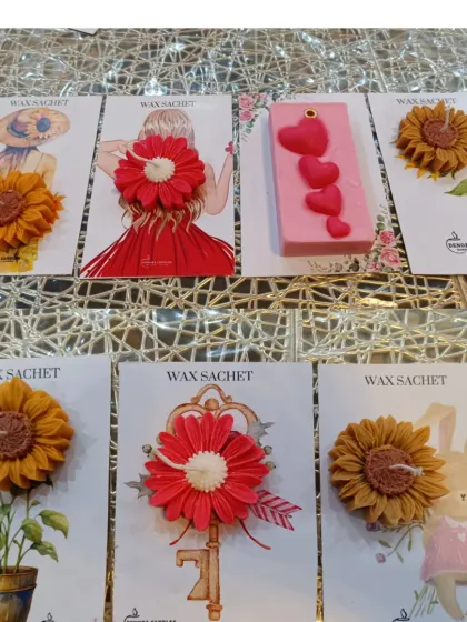 I also create these charming handmade wax sachets. They are a wonderful, flame-free way to scent smaller spaces like wardrobes or drawers, and they come in a variety of artistic designs.