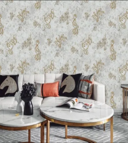 This wallpaper features an elegant pattern with gold accents on a light, textured background. It's a great choice for a formal living room, adding a touch of luxury and sophistication that pairs well with modern furniture.