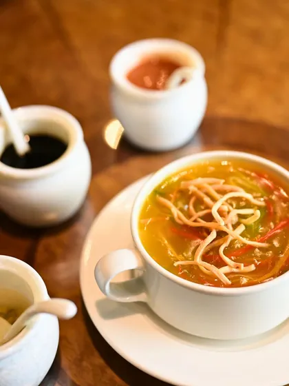 Our Manchow Soup is packed with flavor, combining spicy and sour notes with the satisfying crunch of fried noodles. It's the perfect way to start your meal.