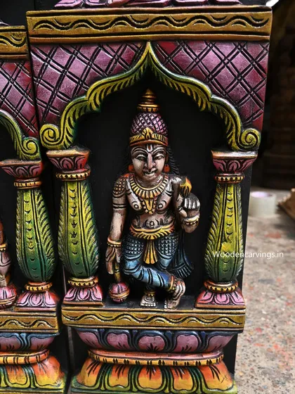 A detail of the lower section of the AshtaLakshmi panel, featuring a smaller deity in an architectural niche. The entire panel is filled with intricate details from top to bottom.