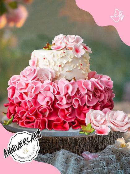 This dramatic two-tier anniversary cake features a cascade of pink ombre ruffles. It's a true work of art, crafted for a wonderful couple in Greater Kailash 2.