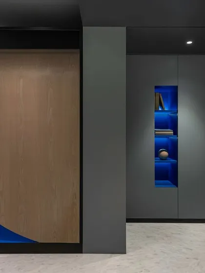 We approach even traditional spaces with a modern, sculptural sensibility. This family temple, conceived as a 'Ghoonghat' or veil, is a doubly curving form set within a metal frame. The design allows only a partial view until you are directly in front of it, creating a moment of quiet contemplation and revealing a vibrant blue interior.