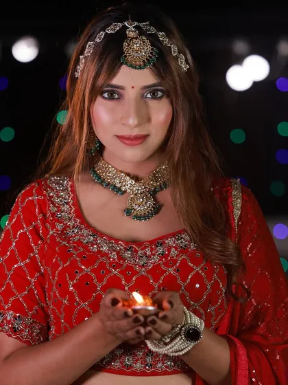 A direct-to-camera portrait from our Diwali-themed collab. The model holds the diya, and the festive lights in the background make this a perfect shot for a seasonal portfolio.