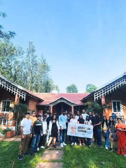 Our group in front of a beautiful cottage-style homestay in Chikmagalur.