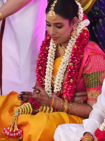 A candid moment from Subasini's muhurtham ceremony. Her makeup looks flawless as she participates in the rituals.