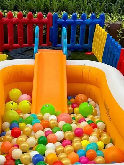 A close-up of the inflatable ball pit that comes with its own small slide. This is a favorite piece of equipment for toddlers at any event.