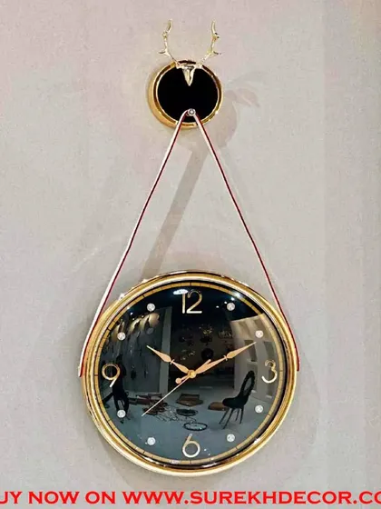 Featuring a creative design on its face, this black and gold hanging wall clock adds an artistic touch to your decor. It combines the elegance of a classic color scheme with a playful, modern aesthetic.