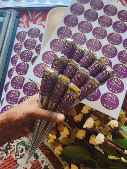 I personally prepare and pack every batch of my organic henna cones. This is a fresh bouquet of cones, sealed for freshness and ready to be shipped. You can see my branding on each cone, which is my promise of quality.
