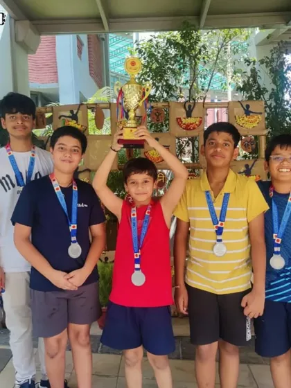Team success is the best success. Viraaj Mishra and his school team celebrate their runners-up trophy at the inter-school badminton tournament, showcasing the power of teamwork.