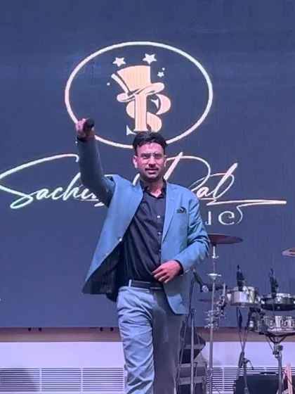 A powerful pose on stage, commanding the attention of the entire room before the next big illusion.