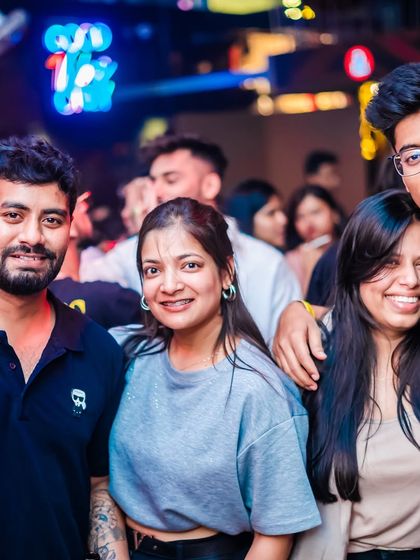 Friends gathering to kick off their week with high-energy music at Happy Brew.