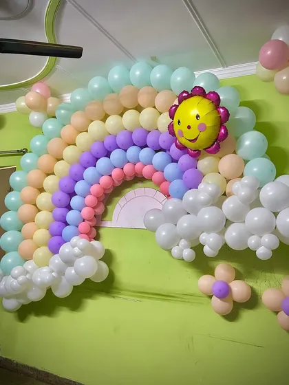 The completed pastel rainbow balloon wall, a fantastic backdrop for photos.