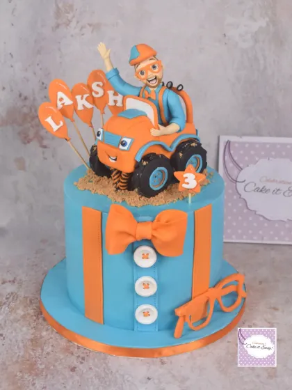A Blippi-themed cake for a 3-year-old. I'll admit, I only know this character because I'm a cake artist, but it was fun to recreate his signature look.