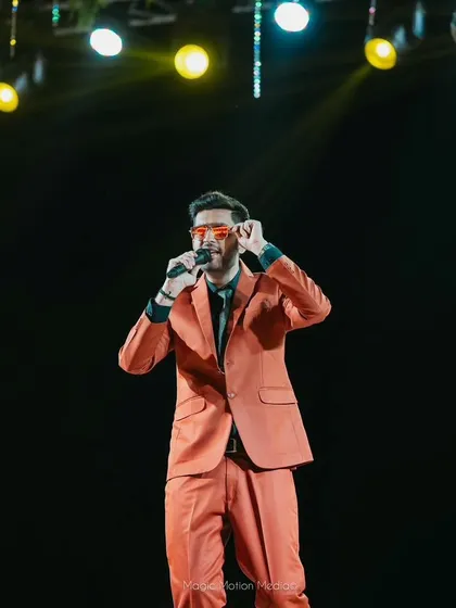 Adjusting my glasses on stage, a small gesture that's part of the performance and my on-stage persona.