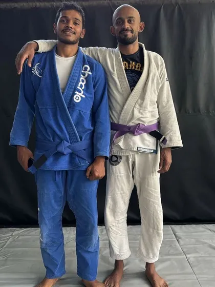 Posing with my coaches and senior belts. Learning from experienced practitioners is the key to growth in Brazilian Jiu-Jitsu.