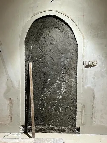 The 'before' shot of a simple wall, waiting for a touch of artistry.