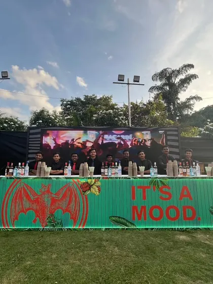 This outdoor festival setup for Bacardi shows our capability to create a full service bar anywhere. The custom branded counter with neon lighting becomes a central hub of activity, serving a wide menu to event guests.