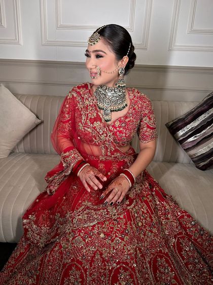 A side profile of our beautiful bride, showing how the jewellery and her smile light up the room.