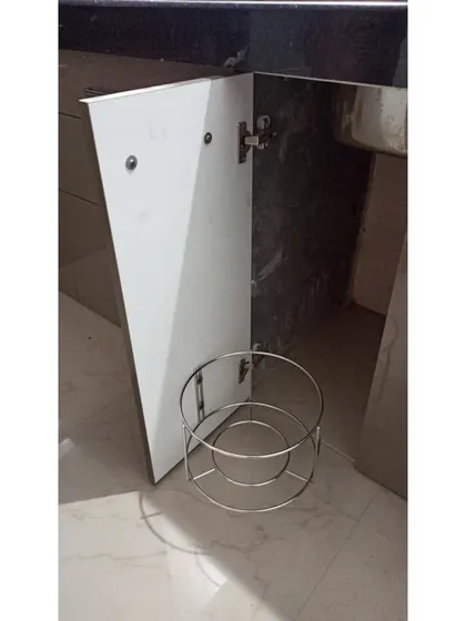 This is a basic cylinder trolley integrated into the under-sink cabinet, a practical solution to keep the gas cylinder hidden from view but easily accessible when needed.