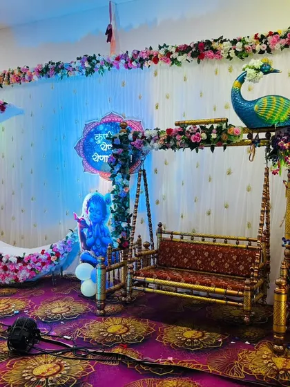 Creating a magical dreamscape for your baby shower is my passion. This setup combines a beautiful floral crescent moon with a traditional swing and a majestic peacock, all set against an elegant backdrop to make your celebration unforgettable. 💖