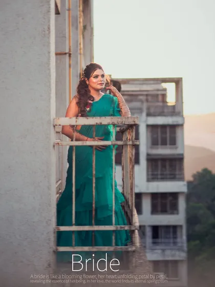 A wide-angle bridal portrait of Priya on a balcony, setting a scene that feels both urban and deeply personal.