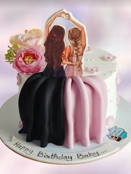 A "best friends" themed cake with flowing fondant dresses. This is a creative and sweet way to celebrate a close friendship.