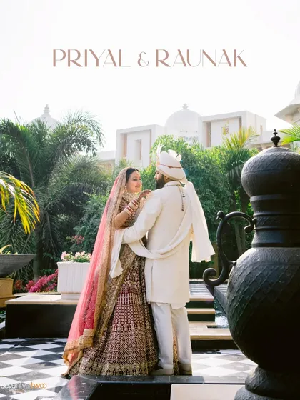 A regal portrait of the couple at The Leela Palace, Udaipur, their traditional attire complementing the grandeur of the heritage location.
